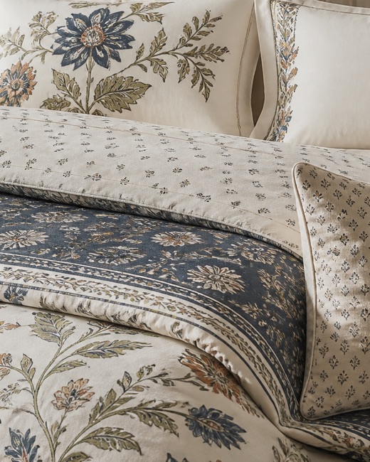 Coordinated duvet cover, pillowcases and folded bedding set in a printed botanical.