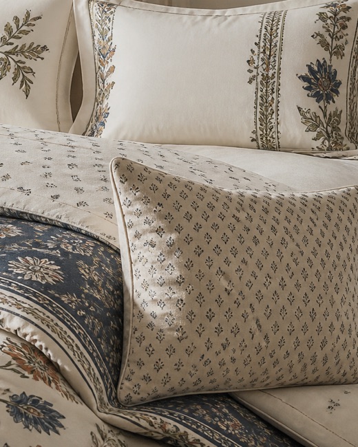 Folded pillowcase and duvet edge showing the printed botanical at pillow scale.