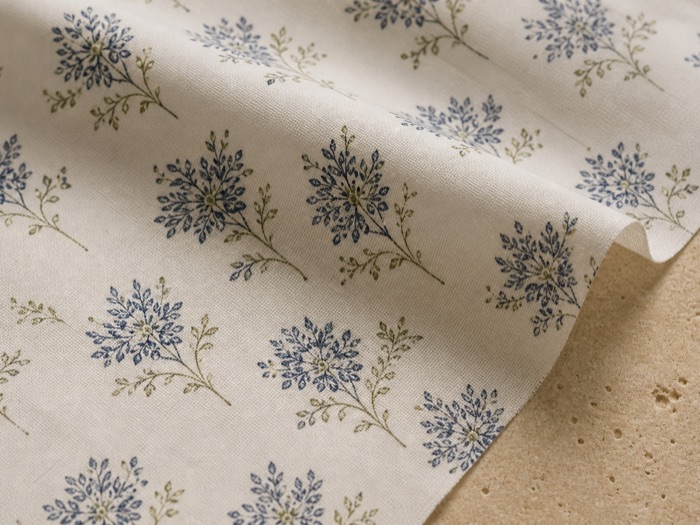 Cotton poplin: fine, closely woven and crisp, holding sharp print.