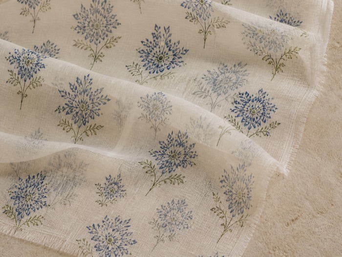Cotton voile: semi-sheer and light, the layer beneath showing through.