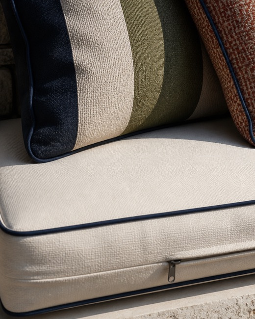 Close view of outdoor cushion piping and seam finishing.